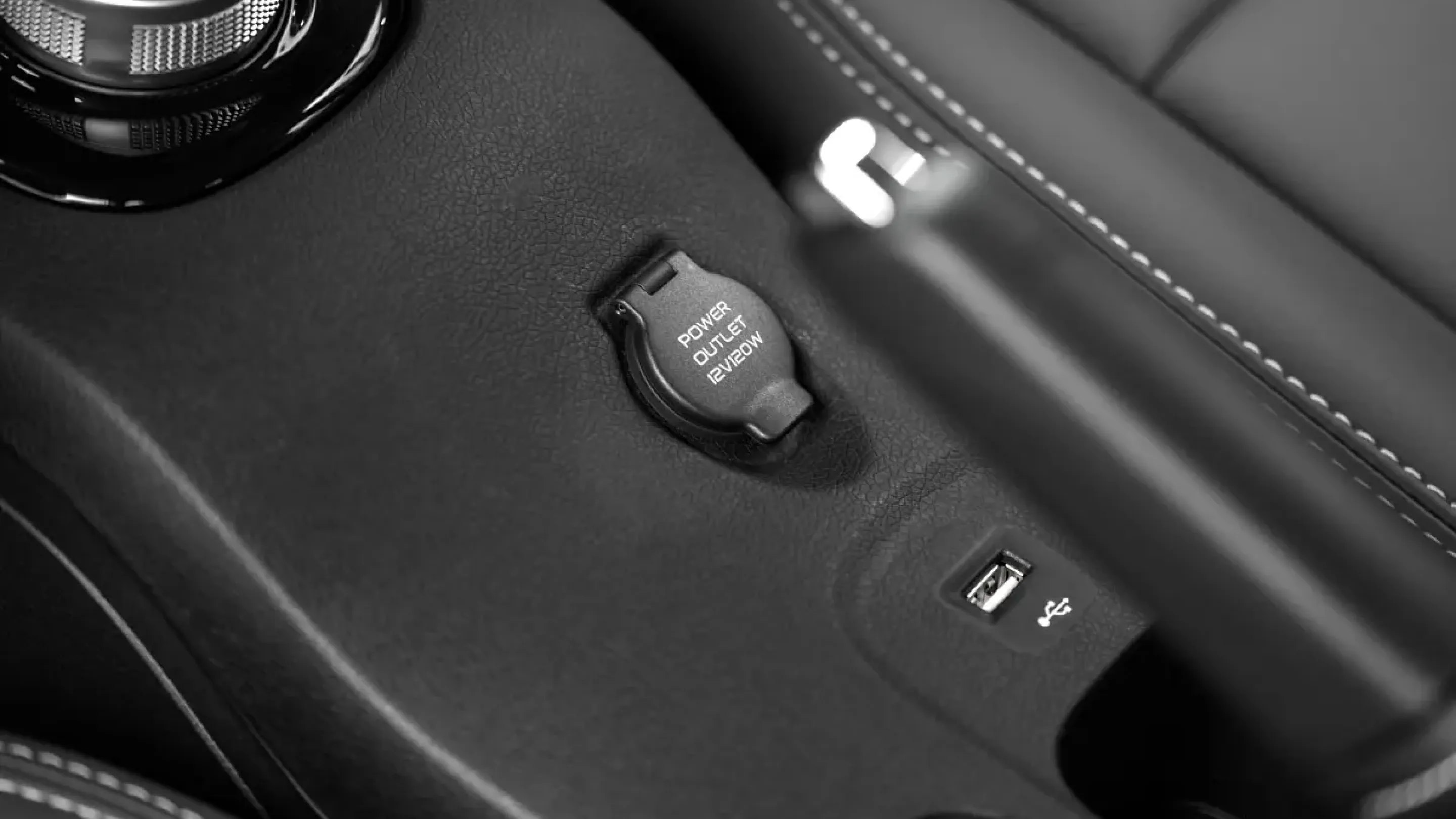 VinFast VF 5 — 12V socket and USB port between the seats